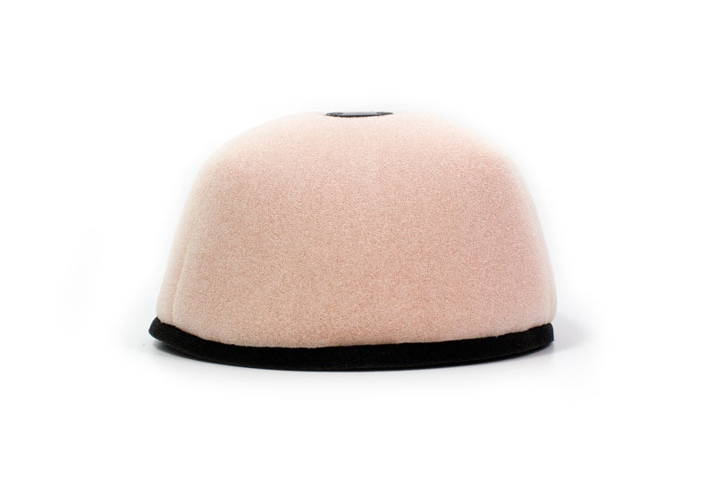 Pink foam air filter with a black base, designed for Honda CRF450/250R, featuring a rounded top and a central opening for airflow.