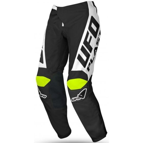 Black and green motocross trousers featuring a sleek design, with prominent white UFO branding and reflective yellow accents on the knees for visibility and style.
