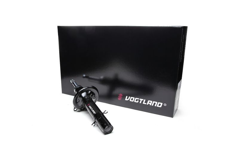 Vogtland Club Lowering Suspension Kit featuring a black shock absorber with red and white branding, positioned beside a sleek black box with the Vogtland logo.