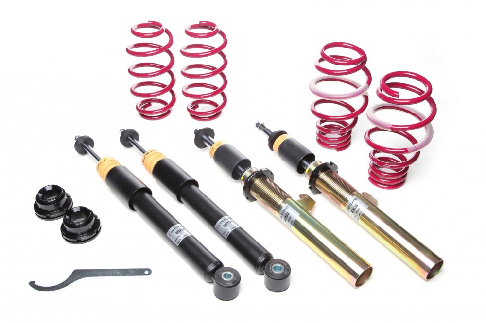 Vogtland Fixed Damping Coilover Kit featuring black and gold shock absorbers, red springs, and installation tools, designed to lower vehicle height by 40-60mm.