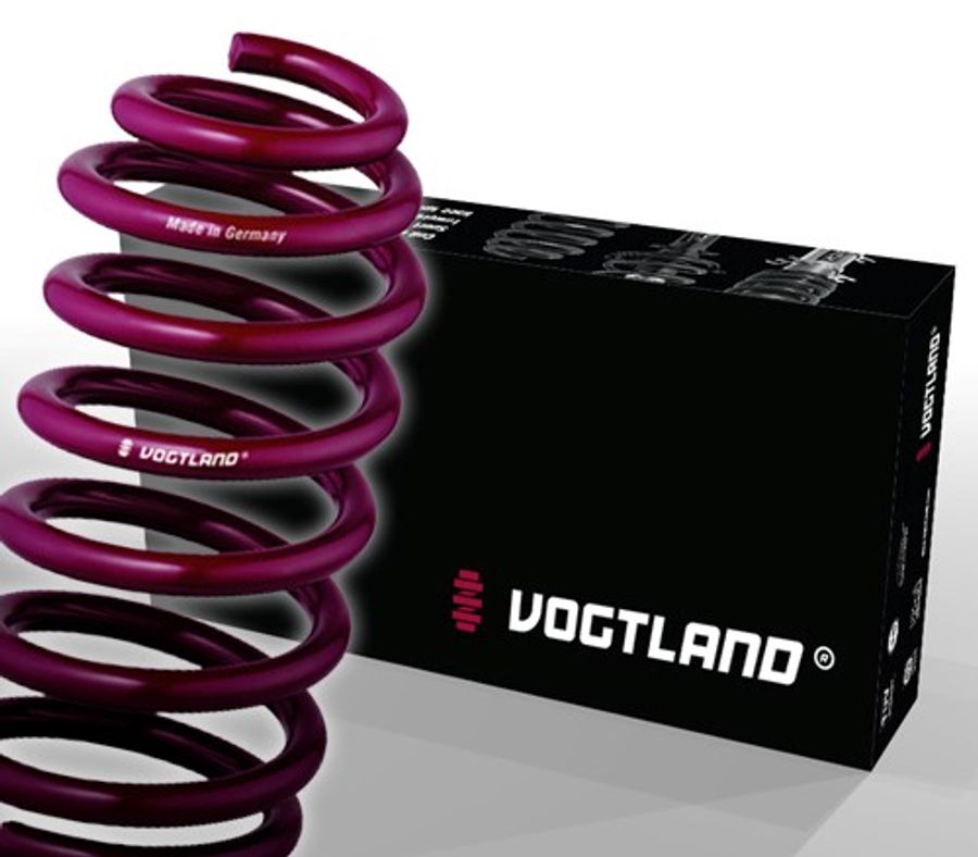 Vogtland Sport Lowering Spring in deep purple, featuring a coil design, alongside its branded black box with white logo and text, designed to lower vehicle height by 20mm front and 30mm rear.