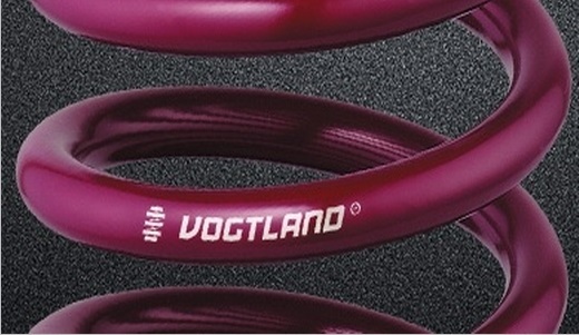Vogtland Sport Lowering Springs in a vibrant purple finish, featuring a smooth coil design, designed to lower the front by 35mm and the rear by 25mm for enhanced vehicle performance.