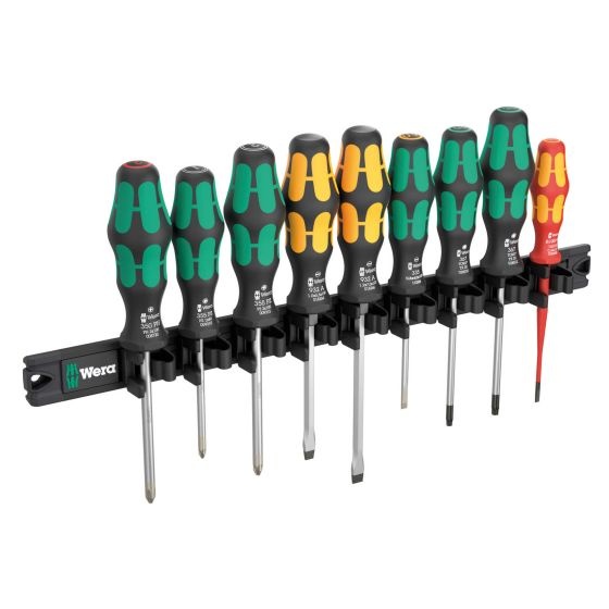 Wera Kraftform screwdriver set featuring nine screwdrivers with ergonomic green and yellow handles, mounted on a black magnetic rail for easy storage and access.