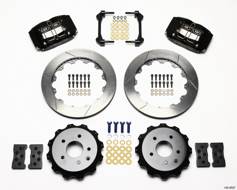 Wilwood 140-9507 Dynapro Radial Rear Brake Kit featuring black calipers, silver rotors, gold and silver hardware, and mounting brackets, designed for OE E-Brake compatibility.