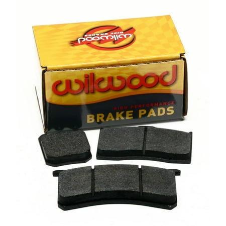 Wilwood's BP-20 7112-20 Forged Dynalite Pad Set features four black brake pads in a yellow and red branded box, designed for high performance with a thickness of 0.49 inches.