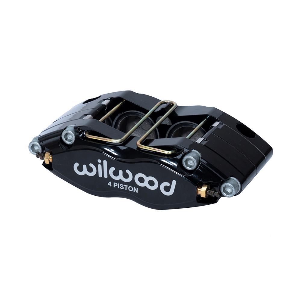 Black radial mount brake caliper with a sleek design, featuring four pistons, gold hardware, and the "Wilwood" logo prominently displayed in white.