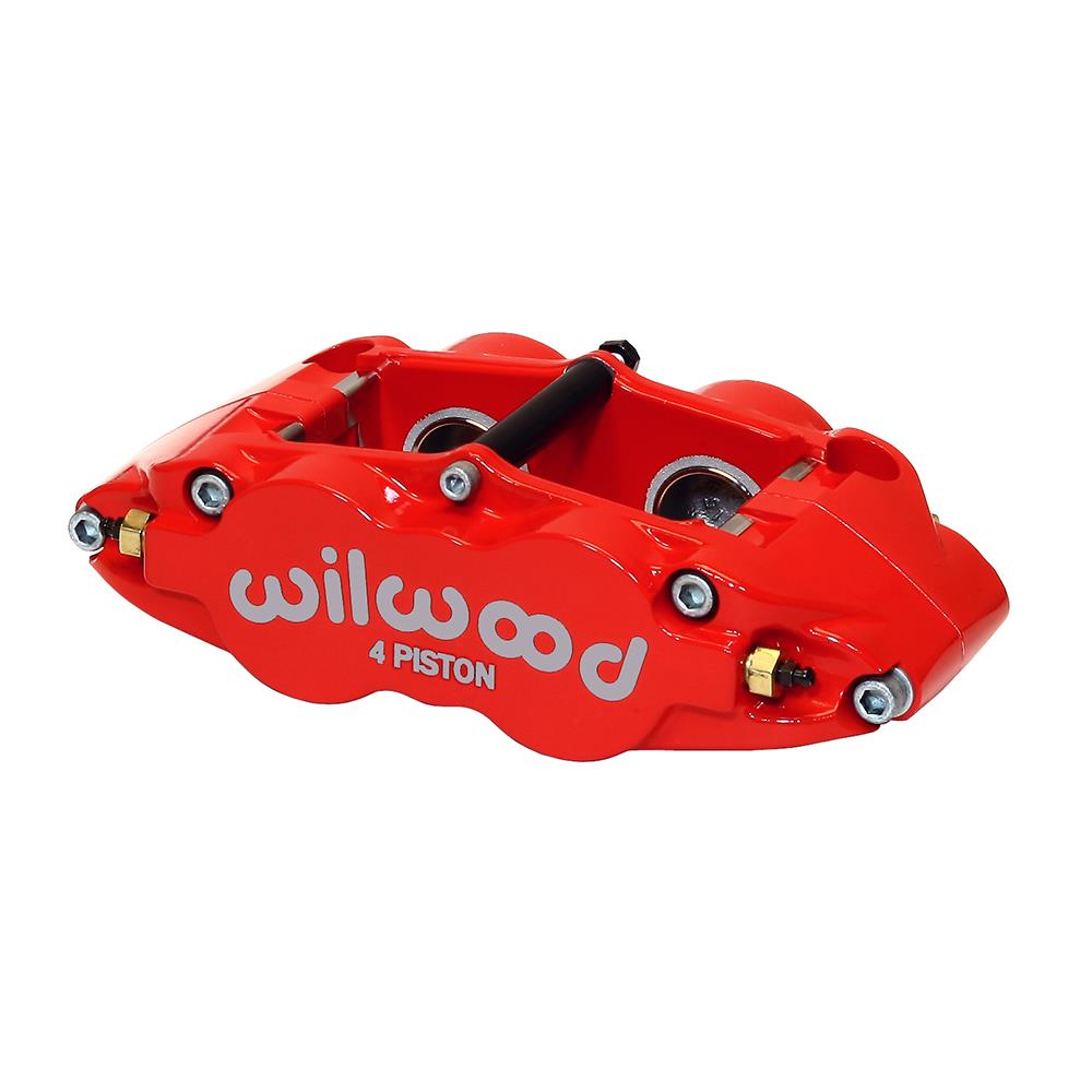 Red forged aluminum brake caliper with four pistons, featuring the "Wilwood" logo prominently displayed in white on the side, designed for radial mounting.