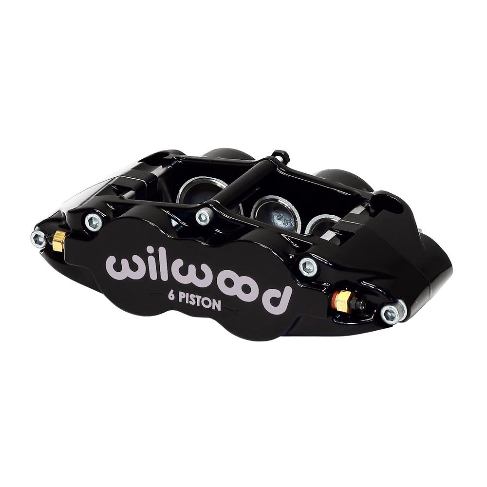 Black forged aluminum brake caliper with six pistons, featuring the "wilwood" logo prominently displayed, designed for radial mount applications.