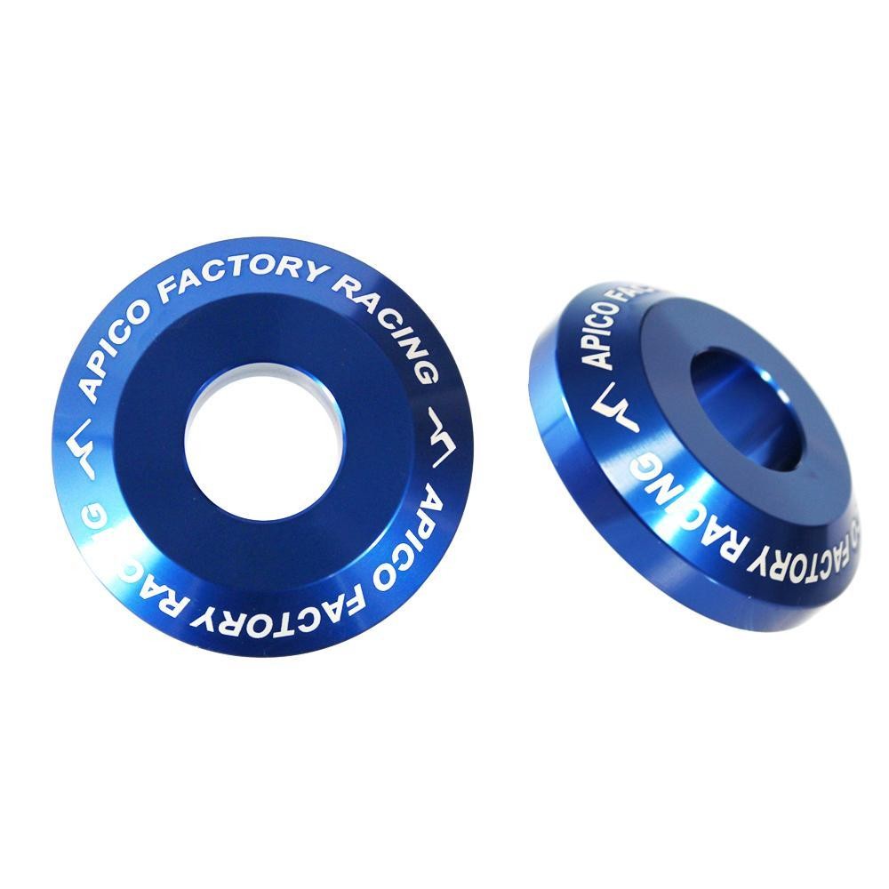 Blue aluminum rear wheel spacers with engraved "APICO FACTORY RACING" text, designed for Yamaha YZ and YZF models from 2003 to 2025, featuring a smooth, polished finish.