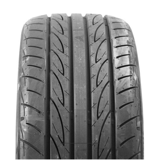 Black performance tire with a sleek tread pattern, featuring deep grooves and a smooth sidewall, designed for enhanced grip and handling in various driving conditions.