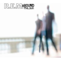 "R.E.M. 'Around the Sun' vinyl album with blurred figures on a bright, abstract background"