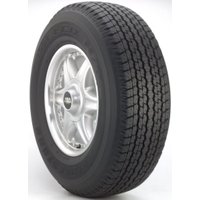 Bridgestone Dueler H/T 840 tire, black with detailed tread pattern, mounted on a silver alloy wheel.