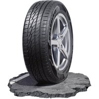 Black General Grabber GT Plus tire, 255/55 R18, with kerbing rib, detailed tread pattern on a rugged stone surface.