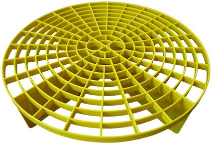 Yellow Meguiar's grit guard with circular grid pattern and raised legs for bucket use.