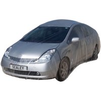 Clear plastic Sealey temporary universal car cover draped over a silver sedan, showcasing full vehicle protection.