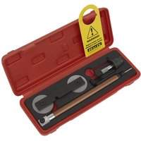 Red Sealey timing tool kit with various metal tools and a yellow warning tag in a molded case.