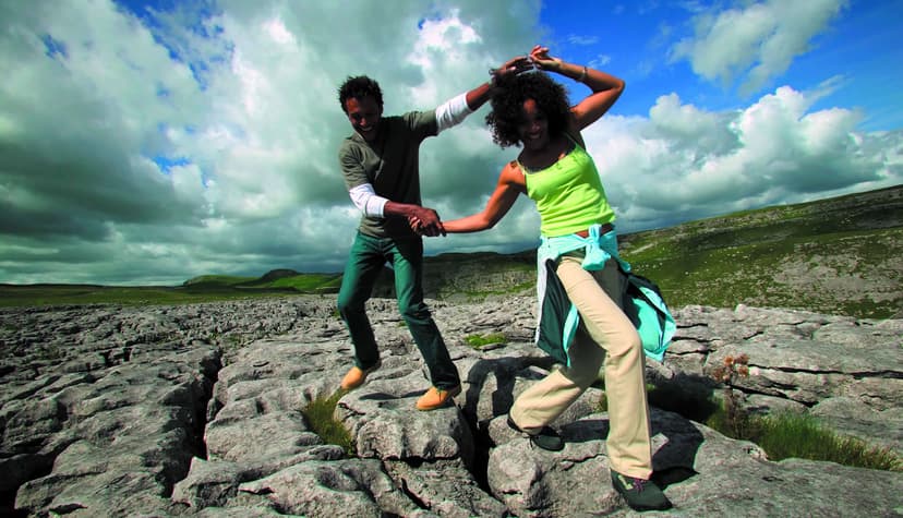 Honeymooning couple on limestone pavement