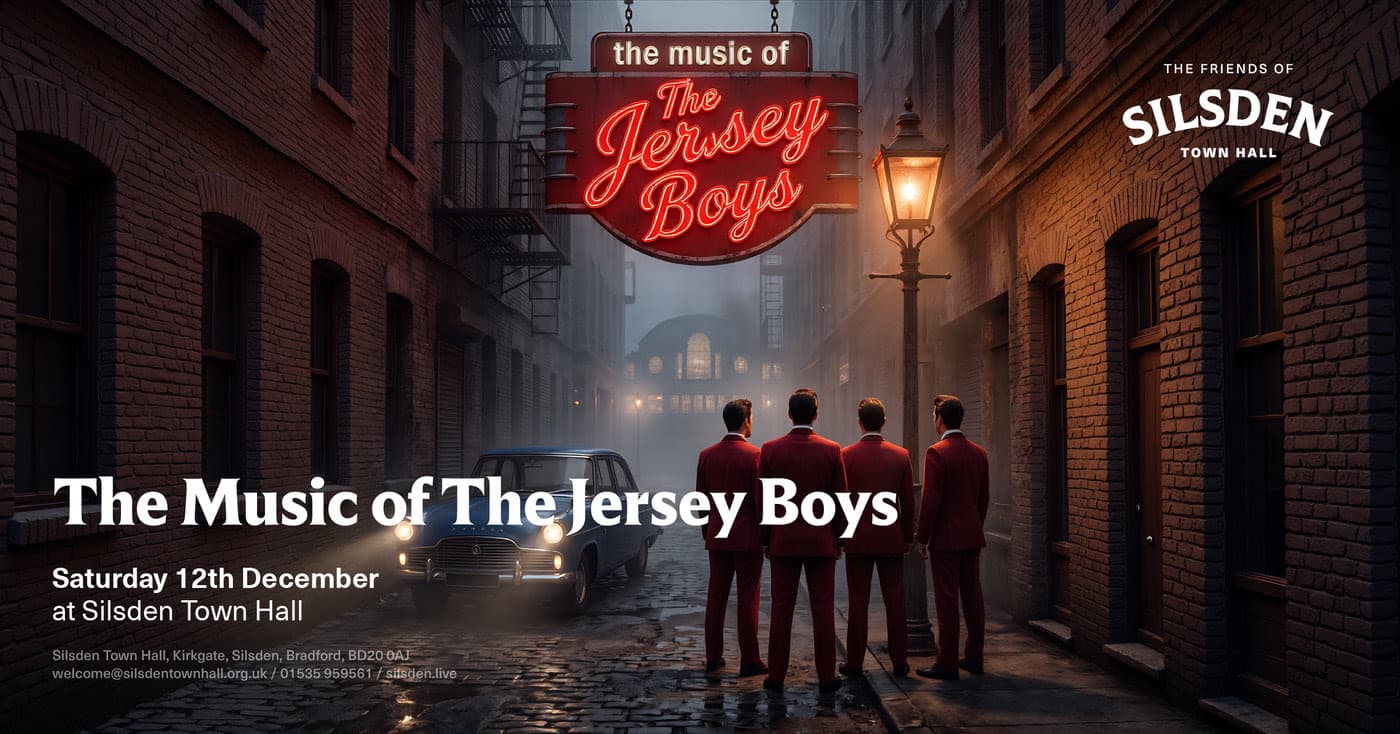 Four men in red suits stand near vintage car under streetlights