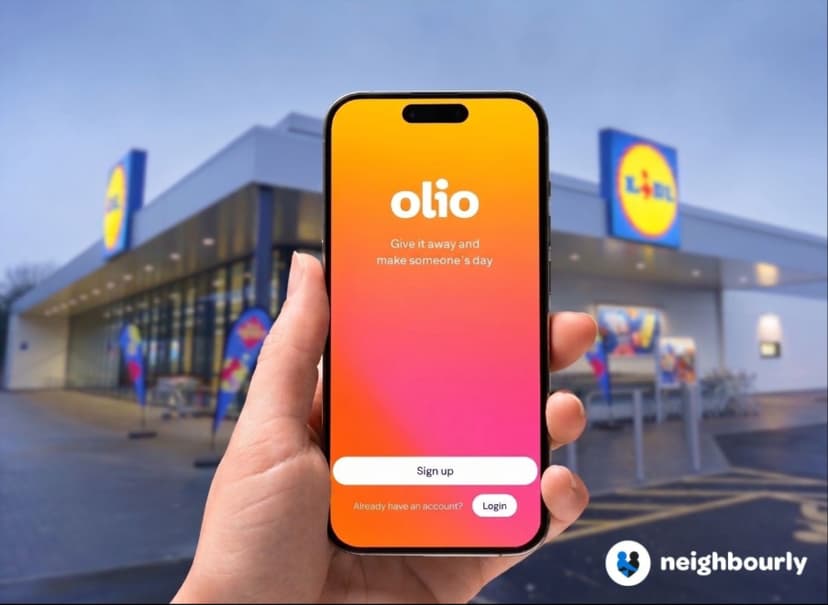 Hand holding smartphone with Olio app in front of Lidl store