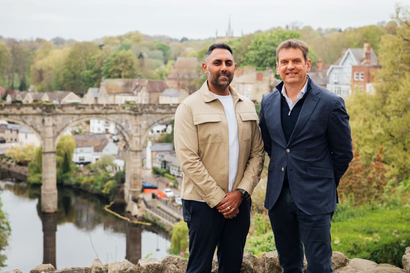 Two men standing with Knaresborough Viaduct and River Nidd