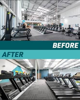 Modern indoor gym with rows of treadmills and bright lighting