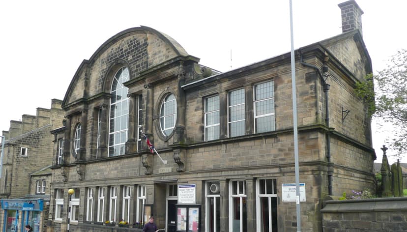 Historic stone library building with arched windows