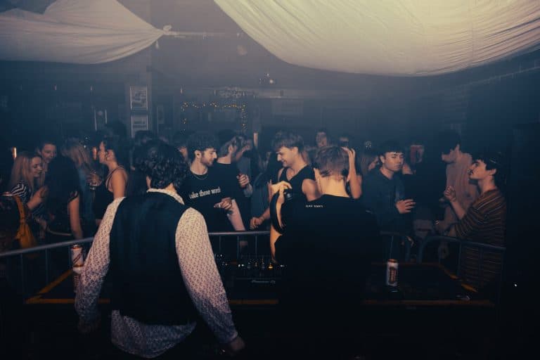 Young adults dancing in a dimly lit Yorkshire nightclub