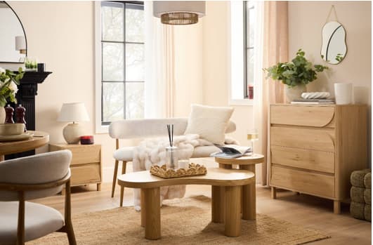 Cosy living room with light wood furniture and beige decor