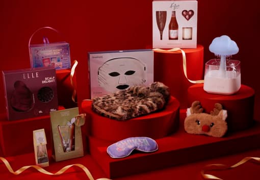 Luxurious skincare and relaxation gift sets on red display