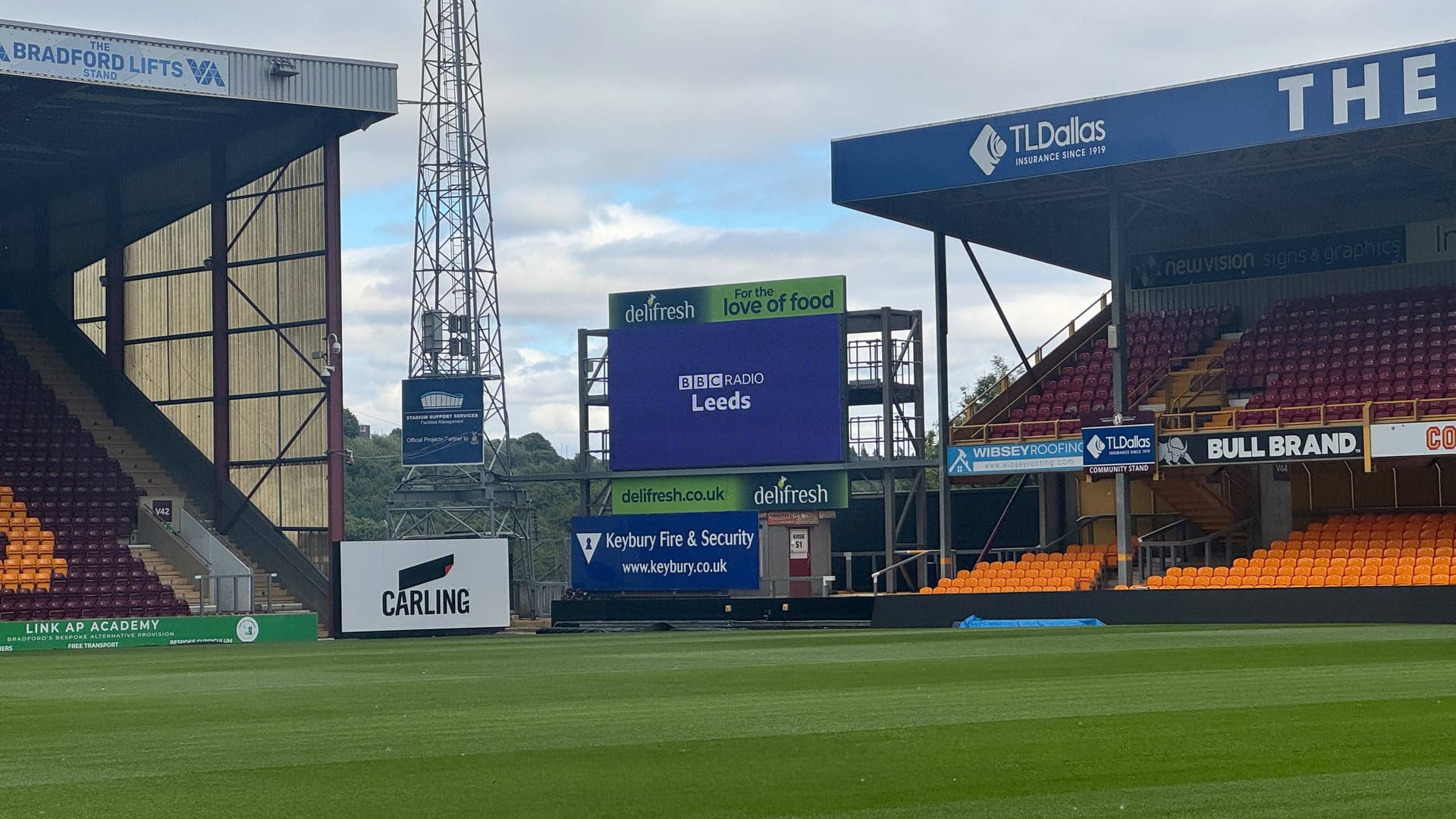 Bradford City football stadium with green pitch and stands
