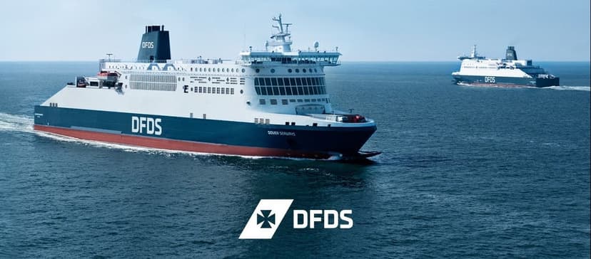 Two large DFDS ferries sailing on a calm blue sea