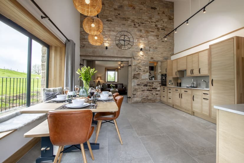 Rustic Yorkshire kitchen with stone walls and countryside view