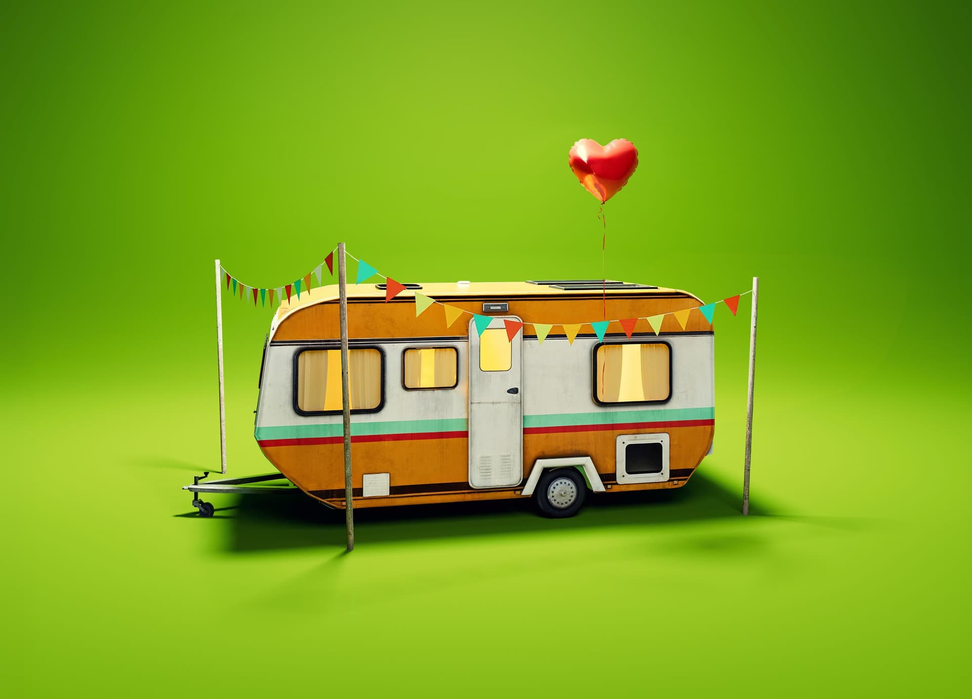 Retro caravan with bunting and red heart balloon on green background