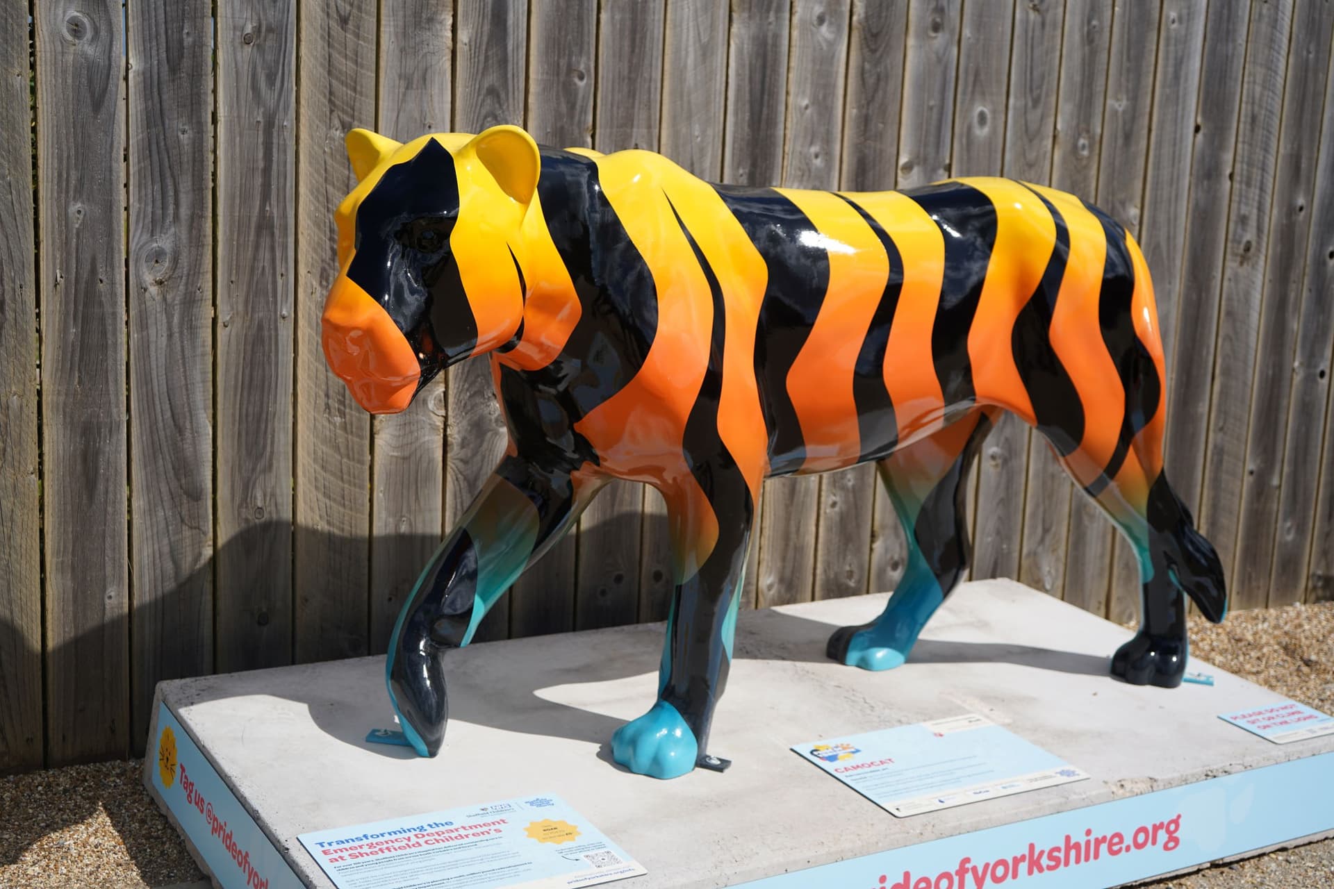 Colorful tiger sculpture with orange and black stripes