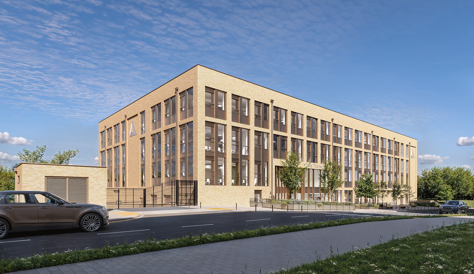 Modern brick office building with large windows under blue sky