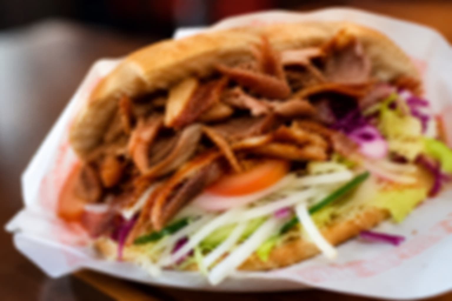 Close-up of a Yorkshire kebab with sliced meat and fresh vegetables