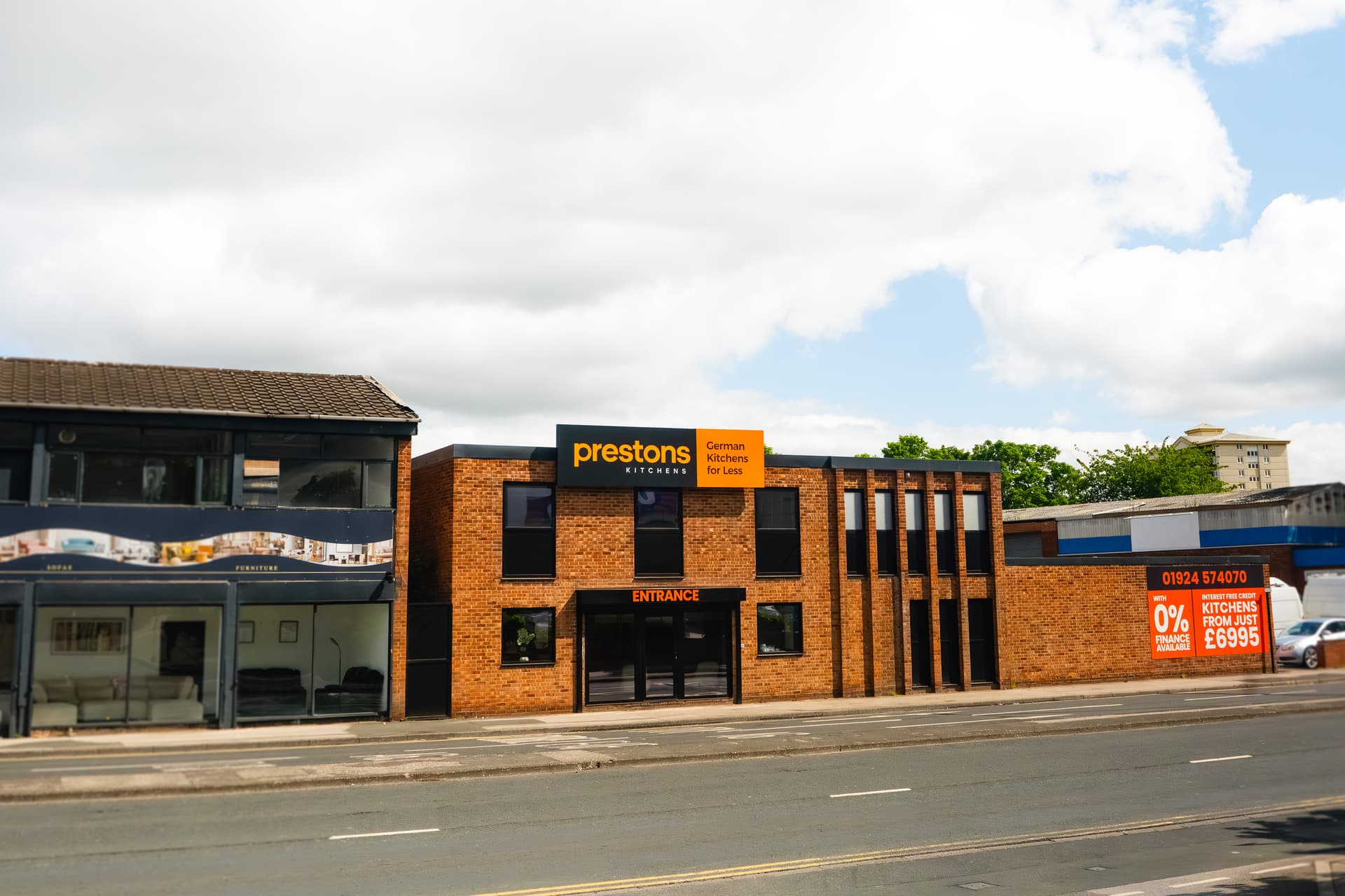 Modern brick showroom for German kitchens on urban street