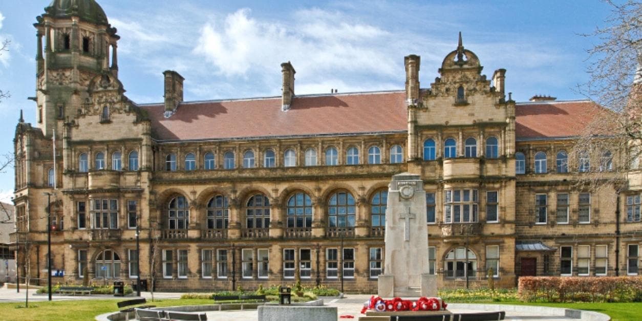 Victorian town hall with clock tower and war memorial