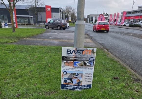 Commercial area in Yorkshire with signage and parked cars