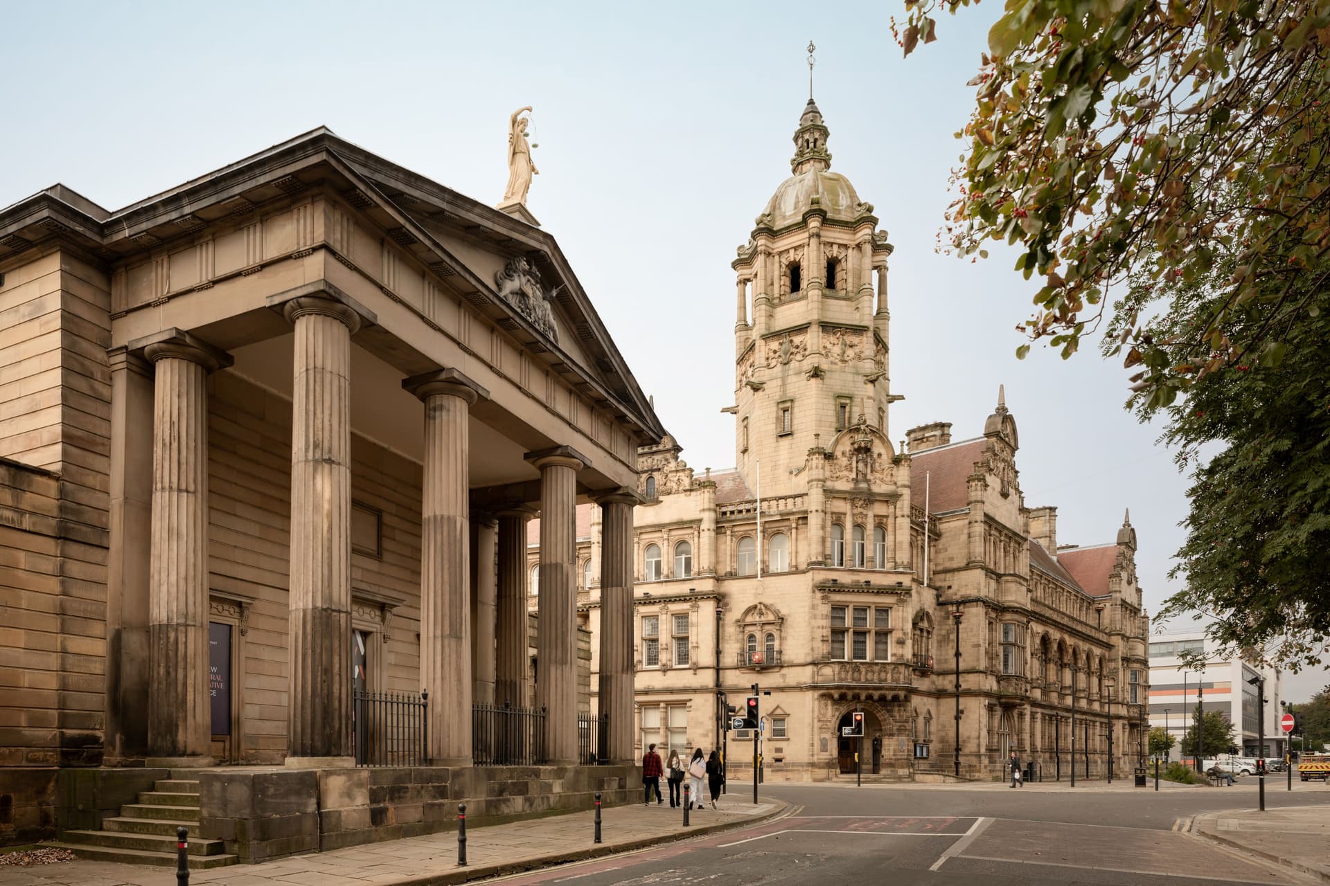 Historic Victorian town hall with clock tower and columns
