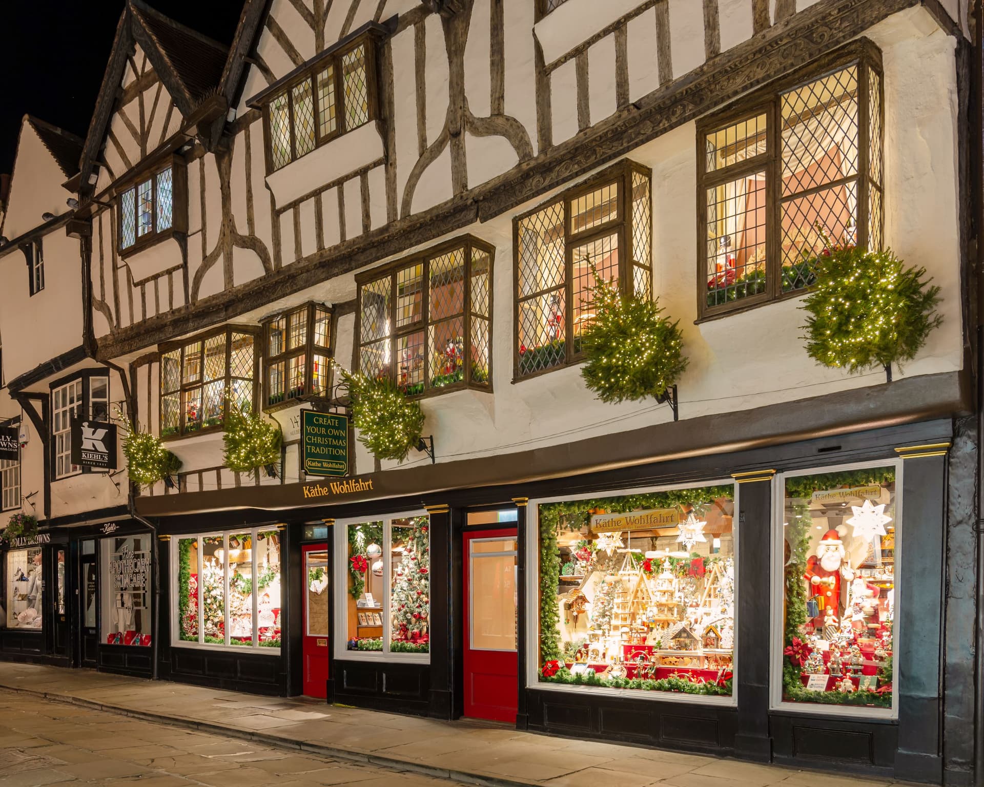 Tudor-style shopfront with festive Christmas window displays