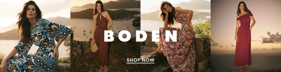 Four models in elegant summer dresses by a coastal landscape