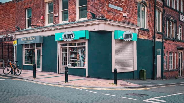 Jewelry shop "Mint" in Sheffield, featuring a bright turquoise sign, large windows, and a brick facade.