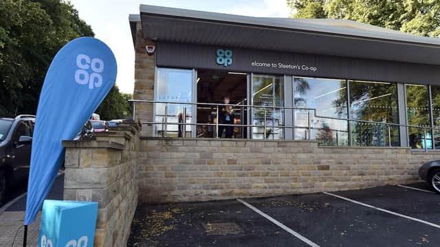 Co-op Food store in Steeton, featuring a welcoming entrance, blue signage, and parking area.