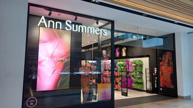 Bright storefront of Ann Summers featuring colorful lingerie displays and promotional signage.