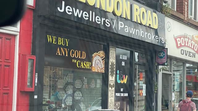 London Road Jewellers storefront with bold signage, gold jewelry display, and a "We Buy Any Gold for Cash" banner.