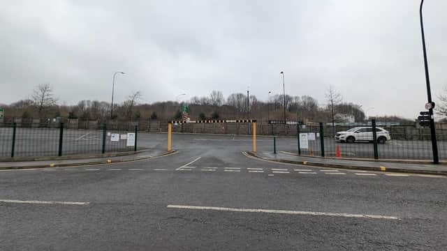 Pay & Display car park entrance in Neepsend, Yorkshire, with barriers, signage, and a white car in the background.