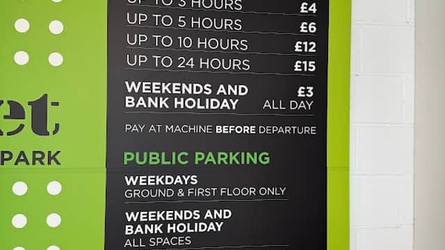 Sign displaying parking tariffs for a multi-storey car park, detailing rates for weekdays and weekends in Hull, Yorkshire.