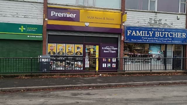 North Anston Pharmacy sign, Premier shopfront, and Family Butcher storefront in Anston, Yorkshire.