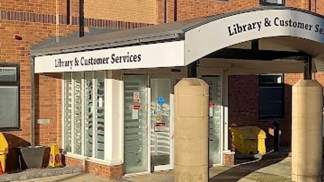 Library and Customer Services entrance with a brick building and the Redcar & Cleveland Borough Council logo visible.
